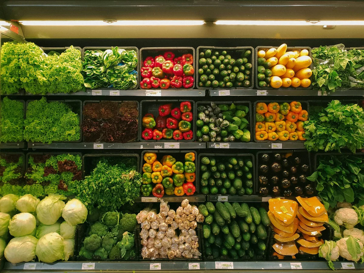 Approachable neighborhood grocery store layout with fresh produce and dry goods